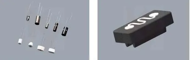 A dark ceramic core block with a serpentine channel cut into its face, beside five small coil elements and three white wick pieces