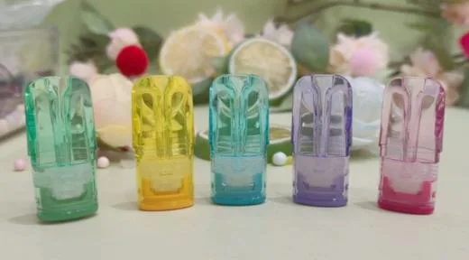 Five translucent empty pod shells standing in a row with cut fruit behind them