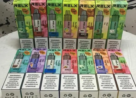 Sealed RELX pod cartons stacked in rows, with English nicotine warnings printed on the visible ends